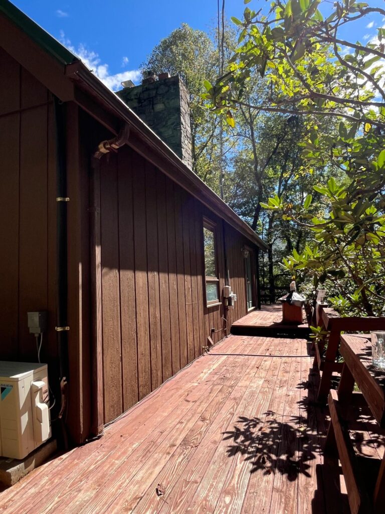 Fence Painting job in progress — Custom Painting of Asheville Inc